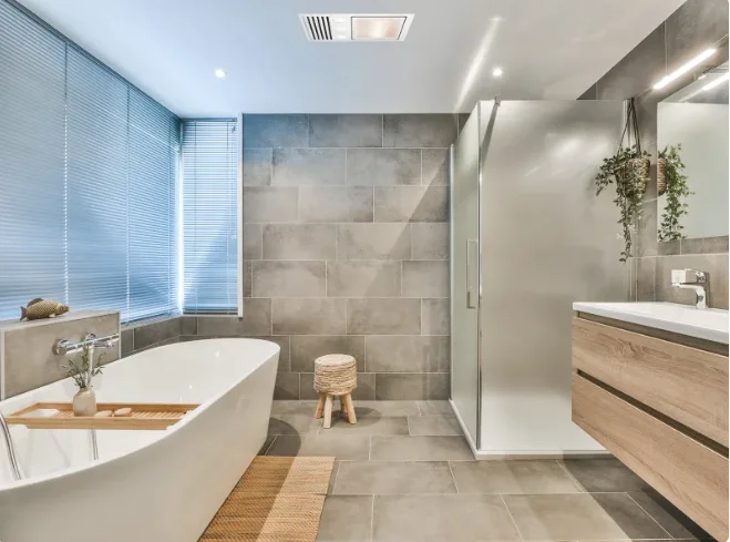 Contemporary bathroom with a freestanding bath and timber vanity